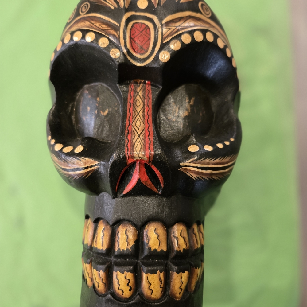 Hand-Carved Black Decorative Skull with Red & Gold Accents